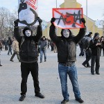 Anti-ACTA demonstrators wearing Guy Fawkes masks.